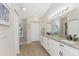 Elegant bathroom with double vanity at 110 Abercrombie Ave, Englewood, FL 34223
