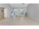 Bright and airy entryway with tile floors and views to the backyard at 110 Abercrombie Ave, Englewood, FL 34223