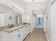 Double vanity bathroom with granite countertops at 110 Abercrombie Ave, Englewood, FL 34223