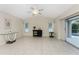 Gathering room with tile floors and sliding glass doors to the patio at 110 Abercrombie Ave, Englewood, FL 34223