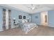 Light and airy bedroom with carpeted floor at 110 Abercrombie Ave, Englewood, FL 34223