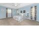 Spacious bedroom with light blue walls at 110 Abercrombie Ave, Englewood, FL 34223