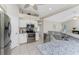 Modern kitchen with stainless steel appliances and granite countertops at 110 Abercrombie Ave, Englewood, FL 34223