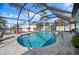 Inviting screened pool with patio and lounge chairs at 1132 Piedmont Rd, Venice, FL 34293