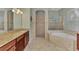 Large bathroom with a soaking tub, shower and double vanity at 13025 Cedar Creek Dr, Port Charlotte, FL 33953