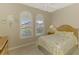 Bedroom with a queen-size bed and two windows at 13324 Golf Pointe Dr, Port Charlotte, FL 33953