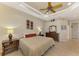 Main bedroom with king bed and access to the backyard at 13324 Golf Pointe Dr, Port Charlotte, FL 33953