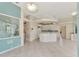 Kitchen with island, white cabinets, and tile floor at 13783 Palmetto Point Ct, Port Charlotte, FL 33953