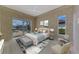 Main bedroom with sliding doors to lanai and pool at 13783 Palmetto Point Ct, Port Charlotte, FL 33953