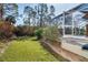 Private backyard with lush landscaping and spacious lawn at 152 Apollo Dr, Rotonda West, FL 33947