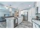Open concept kitchen with island and stainless steel appliances at 152 Apollo Dr, Rotonda West, FL 33947