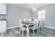 Bright dining room with a farmhouse table and white chairs at 152 Apollo Dr, Rotonda West, FL 33947