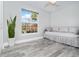Bedroom with daybed and large window, offering ample natural light at 152 Apollo Dr, Rotonda West, FL 33947
