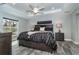 Bright bedroom with a king-size bed, nightstands, and a ceiling fan at 152 Apollo Dr, Rotonda West, FL 33947