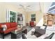 Relaxing patio with seating area, fire pit, and view of the kitchen at 152 Apollo Dr, Rotonda West, FL 33947
