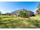 Spacious backyard with a screened-in pool and patio, perfect for entertaining at 152 Apollo Dr, Rotonda West, FL 33947