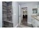 Bathroom boasts a walk-in shower, built-in bench, and granite countertops at 152 Apollo Dr, Rotonda West, FL 33947