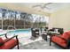 Relaxing pool area with patio furniture and screened enclosure at 152 Apollo Dr, Rotonda West, FL 33947