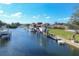 Aerial view of waterfront property with boats and docks at 165 Spyglass Aly, Placida, FL 33946