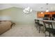 Kitchen features a breakfast bar with seating and modern appliances at 175 Kings Hwy # 236, Punta Gorda, FL 33983