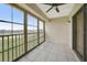 This screened balcony offers a view and a ceiling fan at 175 Kings Hwy # 236, Punta Gorda, FL 33983