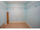 Large walk-in closet with wire shelving and tile floor at 175 Kings Hwy # 236, Punta Gorda, FL 33983