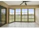 Bright screened balcony overlooking a lush green landscape at 175 Kings Hwy # 236, Punta Gorda, FL 33983