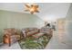 Spacious living room with tiled floors and comfy sofas at 175 Kings Hwy # 236, Punta Gorda, FL 33983