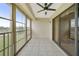 Screened balcony with tile floors and sliding glass doors at 175 Kings Hwy # 236, Punta Gorda, FL 33983
