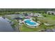 Aerial view of resort-style pool and tennis courts at 175 Kings Hwy # 236, Punta Gorda, FL 33983