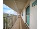 Building hallway with teal door and balcony at 175 Kings Hwy # 236, Punta Gorda, FL 33983
