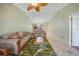 Living room features a ceiling fan and access to kitchen at 175 Kings Hwy # 236, Punta Gorda, FL 33983