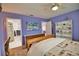 Spacious bedroom with a wooden dresser and a comfy bed at 189 Carlisle Nw Ave, Port Charlotte, FL 33952
