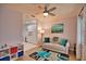 Living room with built-in shelving and a view into the kitchen at 189 Carlisle Nw Ave, Port Charlotte, FL 33952