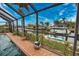 Enjoy the view from the pool and screened patio at 189 Carlisle Nw Ave, Port Charlotte, FL 33952