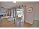 Small dining area with glass table and chairs, overlooks the pool at 189 Carlisle Nw Ave, Port Charlotte, FL 33952