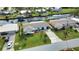 Aerial view of home and neighborhood with canal access at 189 Carlisle Nw Ave, Port Charlotte, FL 33952