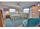 Charming bedroom with a floral comforter and teal accent chair at 189 Carlisle Nw Ave, Port Charlotte, FL 33952