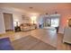 Open living room with hardwood floors, comfortable furniture, and access to backyard at 189 Carlisle Nw Ave, Port Charlotte, FL 33952