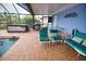 Spacious pool area with patio furniture and hot tub at 189 Carlisle Nw Ave, Port Charlotte, FL 33952