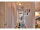 Bright hallway with a patterned rug and access to other rooms at 189 Carlisle Nw Ave, Port Charlotte, FL 33952