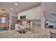 Modern kitchen with granite counters, stainless steel appliances, and breakfast bar at 189 Carlisle Nw Ave, Port Charlotte, FL 33952