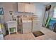 Laundry room with washer, dryer, utility sink, and extra storage at 189 Carlisle Nw Ave, Port Charlotte, FL 33952