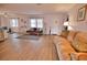 Living room features hardwood floors, comfy seating, and lots of natural light at 189 Carlisle Nw Ave, Port Charlotte, FL 33952