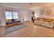 Living room with hardwood floors, daybed, and neutral color scheme at 189 Carlisle Nw Ave, Port Charlotte, FL 33952