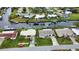 Wide aerial showcasing neighborhood and waterfront at 189 Carlisle Nw Ave, Port Charlotte, FL 33952