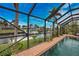 Relaxing screened pool and spa overlooking a peaceful canal at 189 Carlisle Nw Ave, Port Charlotte, FL 33952