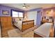Light and airy bedroom with wooden furniture at 189 Carlisle Nw Ave, Port Charlotte, FL 33952