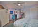 Serene bedroom with a floral comforter and teal accent chair, offering ample space at 189 Carlisle Nw Ave, Port Charlotte, FL 33952