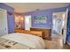 Bedroom with wooden dresser and view to hallway at 189 Carlisle Nw Ave, Port Charlotte, FL 33952